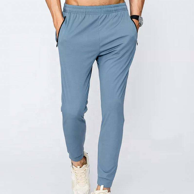 Pantaloni da jogging cargo sportivi in ​​nylon ad asciugatura rapida personalizzati di alta qualit&agrave; del produttore OEM Pantaloni da uomo per palestra fitness sportiva