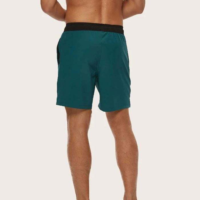 El traje de ba&ntilde;o vendedor caliente de los hombres pone en cortocircuito los pantalones cortos de nataci&oacute;n cl&aacute;sicos de los pantalones cortos de encargo de la cintura el&aacute;stica de los troncos de nataci&oacute;n