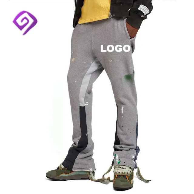 Producent OEM Elastyczny pas Patchwork Graffiti Joggers Niestandardowe logo Ułożone męskie spodnie dresowe Rozkloszowane spodnie dresowe