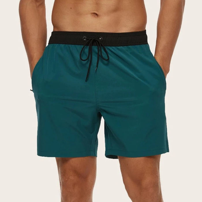 El traje de ba&ntilde;o vendedor caliente de los hombres pone en cortocircuito los pantalones cortos de nataci&oacute;n cl&aacute;sicos de los pantalones cortos de encargo de la cintura el&aacute;stica de los troncos de nataci&oacute;n