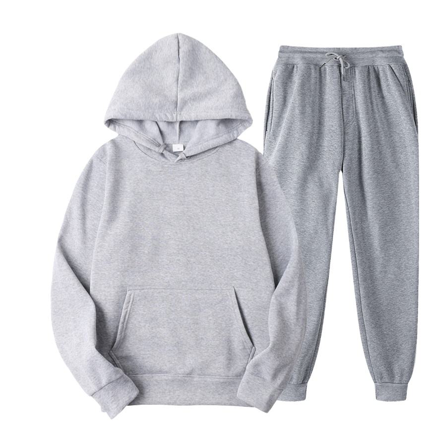 O Hoodie feito sob encomenda do Gym dos homens do algod&atilde;o da aptid&atilde;o e a cal&ccedil;a ajustaram o fato de treino dos homens