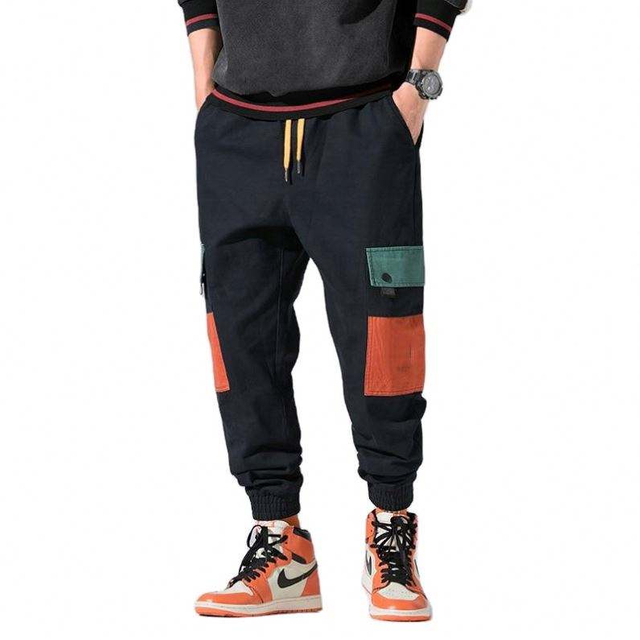 Los bolsillos grandes del bloque de color para hombre de encargo del fabricante del OEM jadean los pantalones multicolores del basculador del cargo de Hip Hop