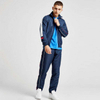 Tuta sportiva da uomo con tasche con zip e collo alto