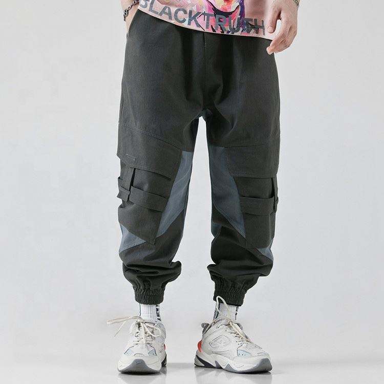 OEM-valmistajan rento Hyv&auml;laatuinen puuvillatyhj&auml; v&auml;rilohko Miesten pussilliset kartiohousut, joissa on sivutaskut