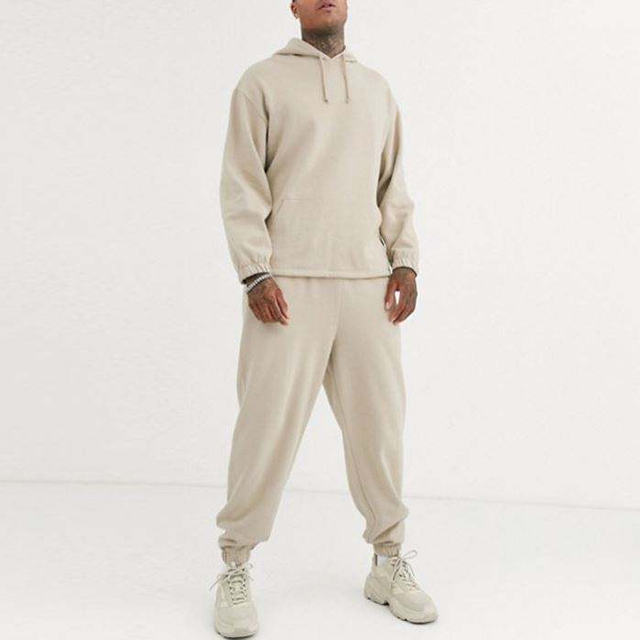 Le plus r&eacute;cent v&ecirc;tement de sport &eacute;l&eacute;gant personnalis&eacute; couleur unie surdimensionn&eacute; hommes Trscksuit