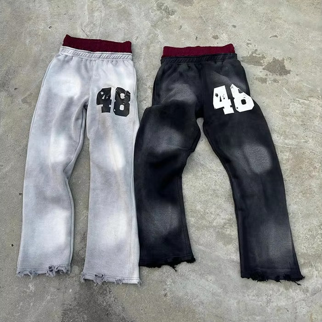 Pantaloni sportivi svasati con lavaggio acido a doppia vita con stampa personalizzata logo Pantaloni sportivi larghi lavati sbiaditi dal sole